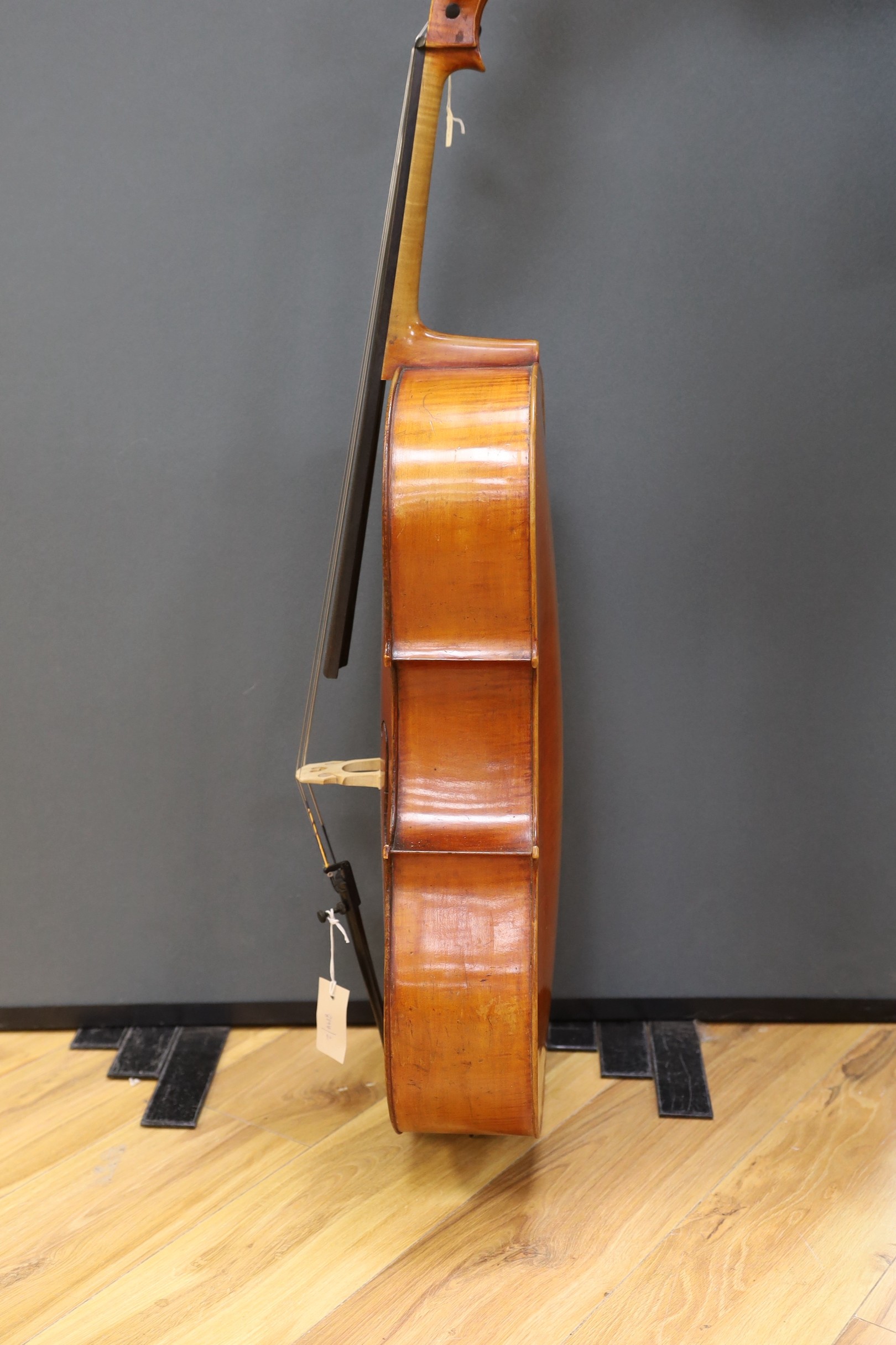 An early 20th century French half size cello, with soft case and bow
